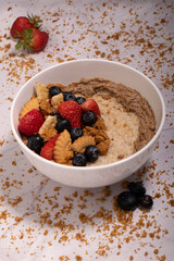 oatmeal bowl with berries and strawberries