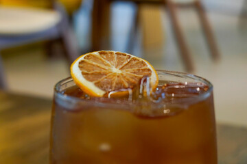 glass of orange juice with ice