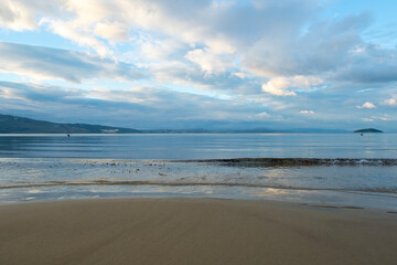Wooden walking track built on the sea. Wooden bridge by the sea. Walking track with wooden floor and iron railings built in the sea. Quay walking area. Sea of ​​Erdek.