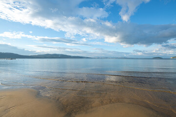 Wooden walking track built on the sea. Wooden bridge by the sea. Walking track with wooden floor and iron railings built in the sea. Quay walking area. Sea of ​​Erdek.