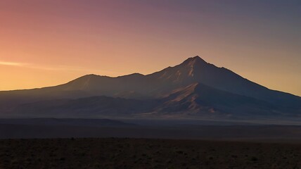 Naklejka premium A lone mountain peak silhouetted against a gradient sunset sky, with minimal details and a clean horizon, evoking solitude and calm.