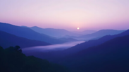 Obraz premium Sunrise Over Misty Mountains: A Serene Landscape