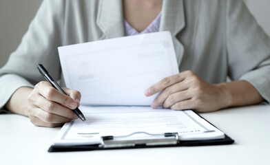 Business woman employer holding resume hiring recruit looking cv resume to hire candidates,...