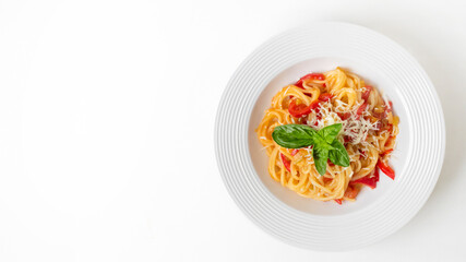 A delicious plate of Italian pasta with basil and cheese topping is perfect for celebrating a cozy Italian dinner