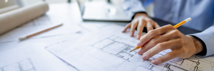 Engineer architect planning on blueprints construction.