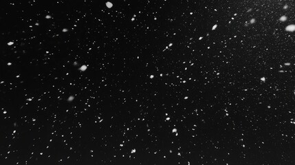 Obraz premium Snow Falling in Slow Motion on Black Background