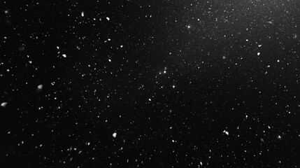 Obraz premium Snow Falling on Black Background in Slow Motion