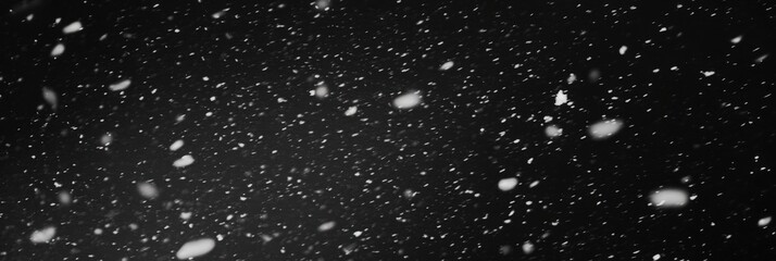 Obraz premium Slow Motion Snowfall on Black Background