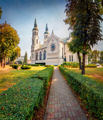 Spectacular mosning view of Minor Basilica of the Sacred Heart of Jesus. Amazing autumn cityscape of Augustow town, Poland, Europe. Traveling concept background.