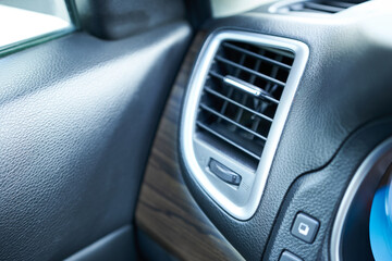 Obraz premium Air conditioner in modern car interior, close up view of air conditioner