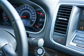 Obraz premium Modern car interior. Dashboard, steering wheel and dashboard. Close up