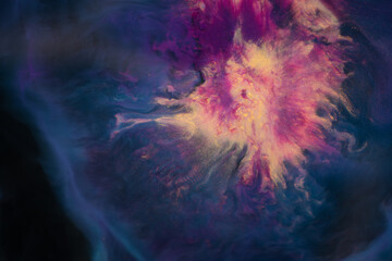 An eyecatching closeup of a purple and yellow painting resembling a gas giant against a dark background, blending elements of art and science