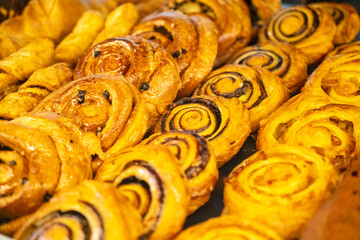 Delicious dessert in the cafe window .Croissants, buns and other appetising pastries.