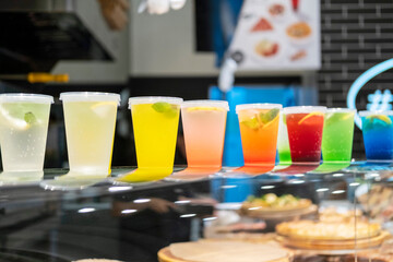 There are colourful cocktails on the counter in the cafe .