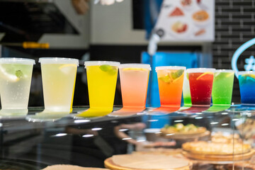 Multicoloured cocktails on the counter at the cafe.
