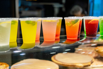 There are colourful cocktails on the counter in the cafe .
