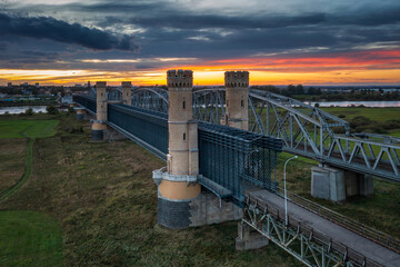 Fototapeta premium Beautiful scenery of Tczew bridge over the Vistula River at sunset. Poland