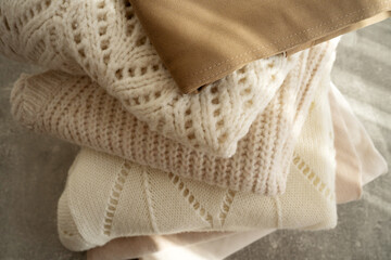 Stack of Cozy Knit Sweaters in Natural Light