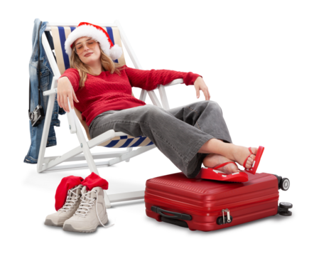 Christmas holiday travel and vacation concept, tourist woman in travel attire, wears a Santa hat and sunglasses, relaxes on deck chair with trolley suitcases after her trip. Flight and travel booking