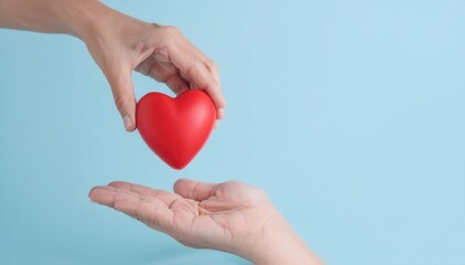 Hands exchanging a red heart on a blue background.