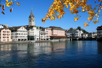 Zurich city, Switzerland. Limmat river view. Autumn leaves - fall season leaf color.