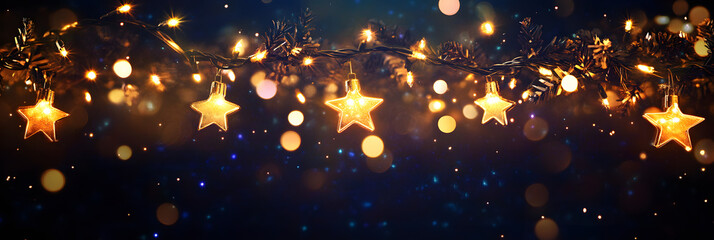 Fototapeta premium Christmas warm gold garland lights over dark background with glitter overlay