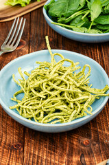 Green pasta on a plate