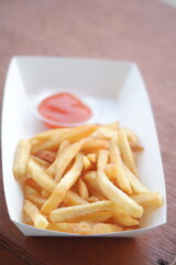 Fries on white dish.