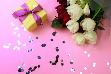  tulips  and gift box on pink background. Stylish soft image of spring flowers. Happy womens day. Happy Mothers day- Image