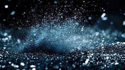 Obraz premium A monochrome photograph showcases a dark and blue backdrop with minute water droplets at the base