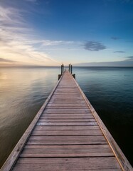 Fototapeta premium Wooden pier extending into calm waters