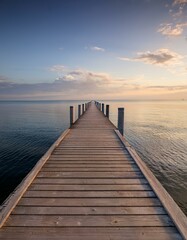 Naklejka premium Wooden pier leading out to sea