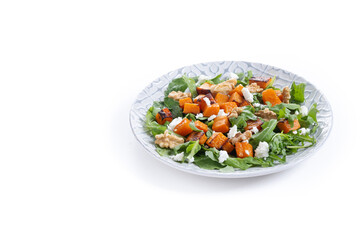 Pumpkin salad with arugula, walnuts and feta cheese isolated on white background. Copy space