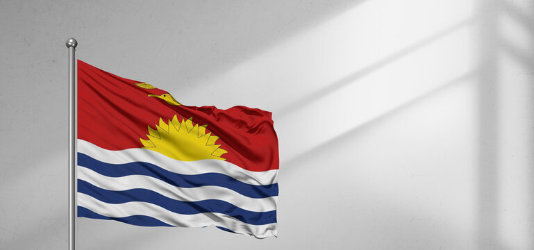 Kiribati national flag cloth fabric waving on beautiful window light grey Background.