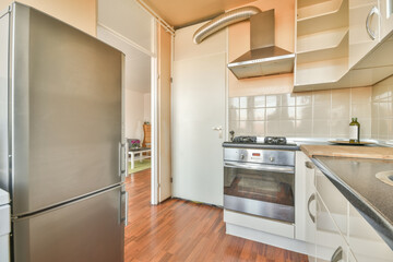 Compact modern kitchen interior with stainless steel appliances