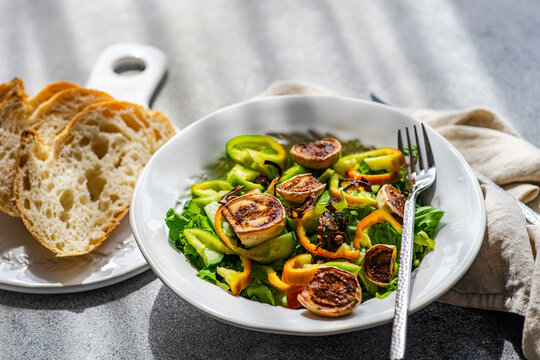 Freshly prepared hot salad with eggplant and sesame seeds