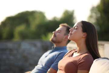 Fototapeta premium Relaxed couple breathing fresh air in a terrace