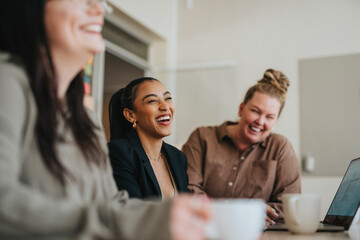 Happy female business professionals at meeting in office