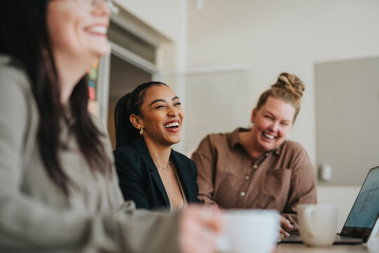 Happy female business professionals at meeting in office