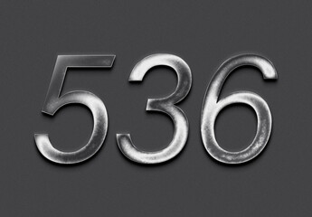 Chrome metal 3D number design of 536 on grey background.