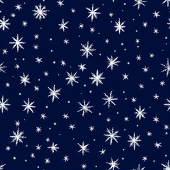 A blue background with white snowflakes scattered all over it
