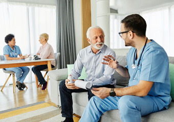 nurse doctor senior care caregiver help assistence wheelchair retirement home nursing elderly woman...