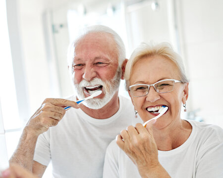 woman tooth bathroom toothbrush hygiene senior morning routine brushing toothpaste care dental elderly home retirement mouth mirror health cleaning man couple