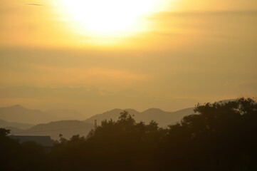 sky ,tree , mountain and house background or a house and tree