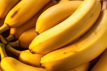 Close-up of ripe bananas. Yellow fruit bunch with many bananas. Fresh, natural, and healthy snack or dessert. Ripe bananas are rich in vitamins, minerals, and antioxidants.