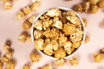 Sweet caramelized popcorn in a bucket top view
