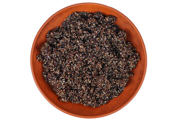 Cooked black quinoa in clay bowl isolated on a white background