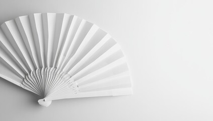 Mockup of a white folding hand fan set apart against a white background