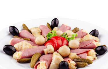 Meat rolls with cheese decorated with mushrooms on white plate