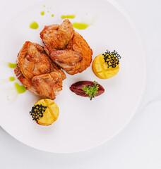 Gourmet fried chicken with caviar and purees